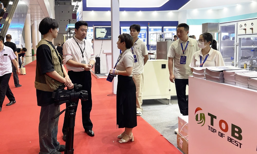 TOB NEW ENERGY executive being interviewed by a CCTV host at CIBF 2025